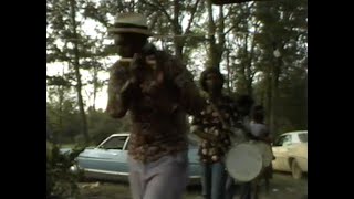 Napoleon Strickland and kids: fife-and-drum picnic preparation (1978)