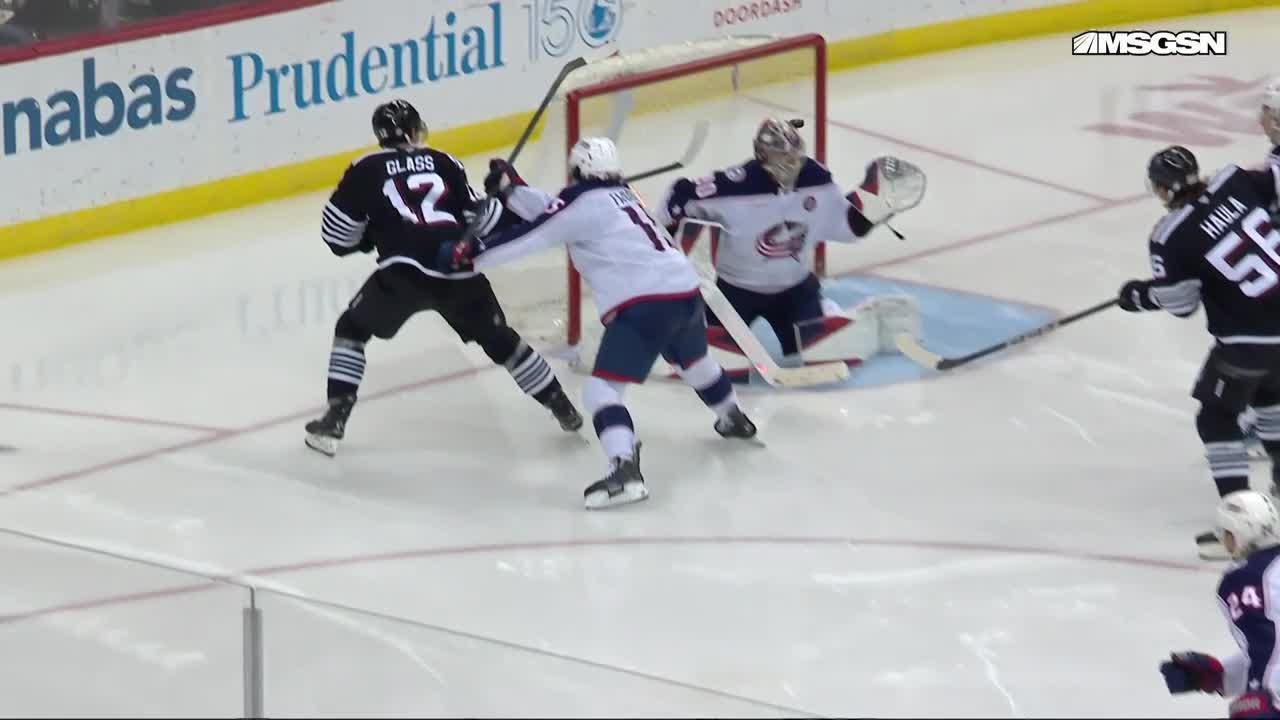 Luke Hughes scores a goal against the Columbus Blue Jackets