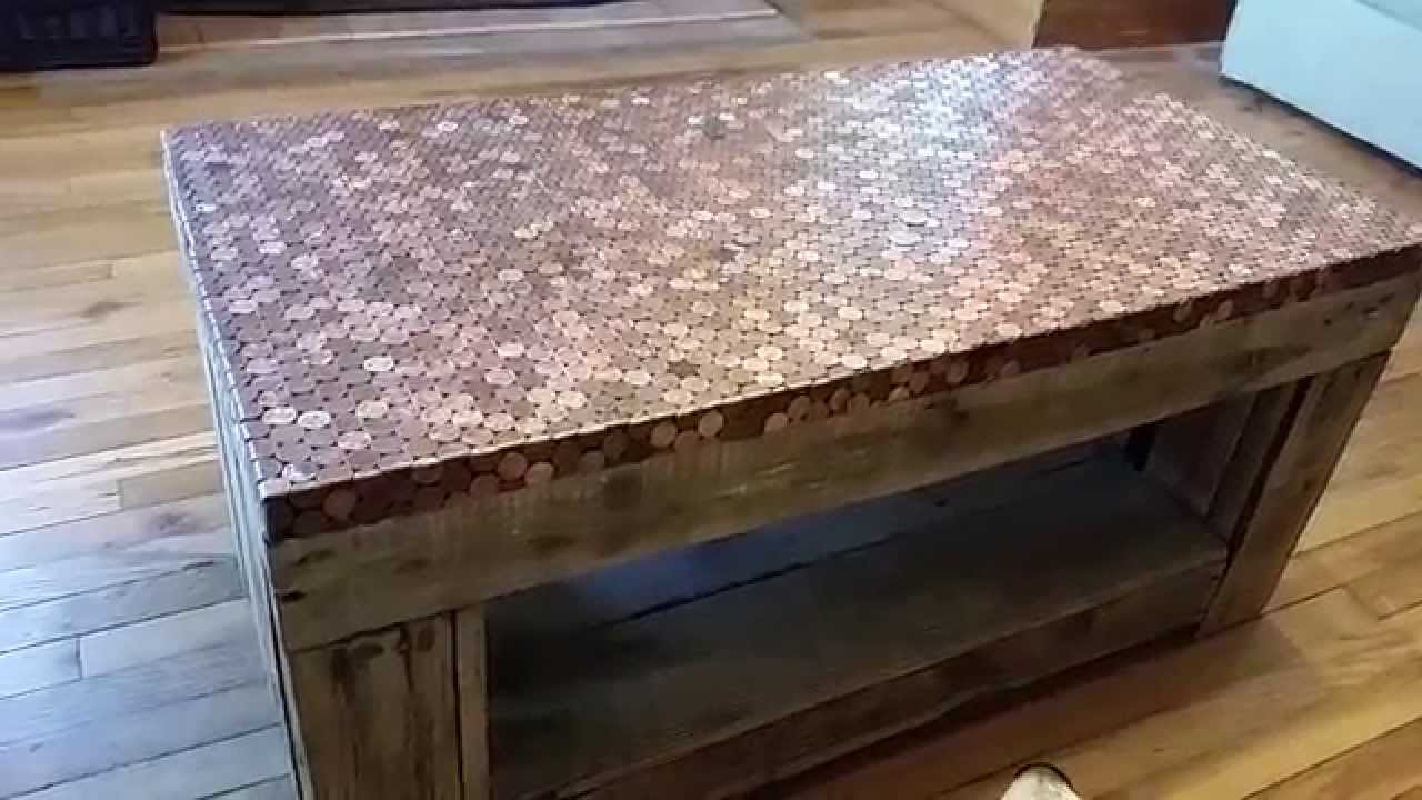 A look at a pallet table coated in pennies 