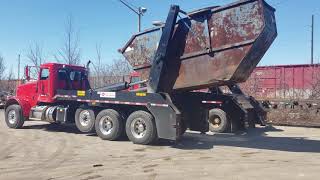 ACE Lugger Truck Lifting Loaded Container
