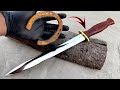 Rusty horse shoe type iron forged into a dagger  leather handle