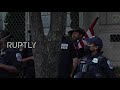 USA: Police escort Trump supporter as crowds gather on DC's BLM Plaza following Biden's elex victory