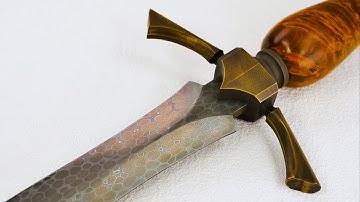 Dragonhide Damascus quillon dagger from bearing balls
