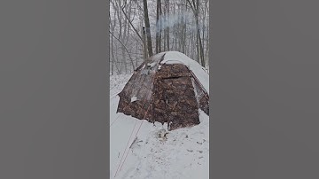 Camping out in the hot tent during a November snow storm