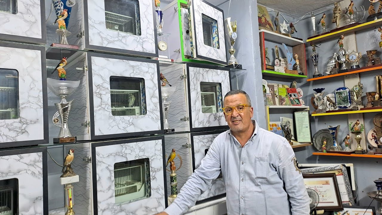 زيارة عند بطل 🏆2025 المغرب في تغريد صنف مالقا عمي نورالدين مع اهم معلومات عن تحفيظ الطيور