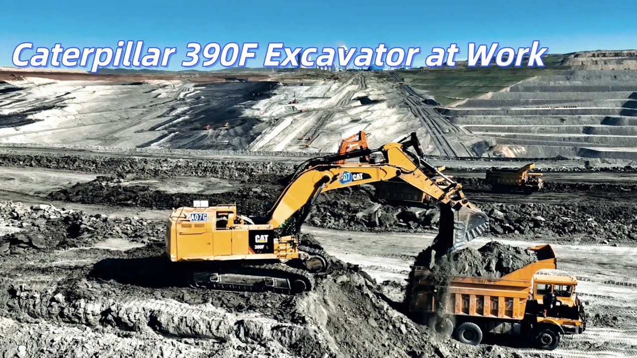 Caterpillar excavator removing overburden in open pit mine loading haul truck