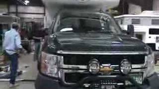 2008 Chevy Lifted with pop-up truck camper