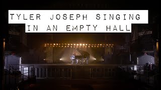 tyler joseph singing acoustic songs in an empty hall
