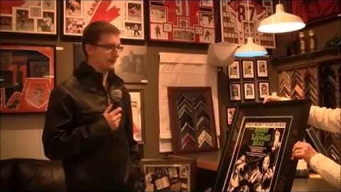 Happy Client Picking Up Custom Framing