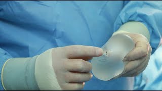 Breast augmenttion. Placing implants under the muscle.