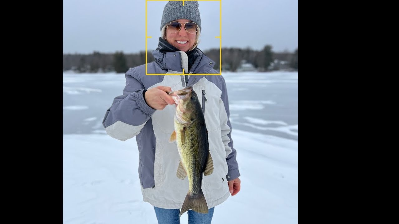 HUGE Large Mouth bass Ice Fishing Baxter Lake in NH… Missi getting it