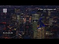 Aerial Footage by night The triumphal way with the business district of Paris La Defense from East