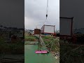 Unloading a cabin from a truck with the help of an American Crawler crane