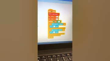 Chase demonstrating the Catch the Dots game he made at camp!