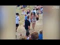 Topless woman attacks man who 'groped' her at Rhythm & Vines music festival