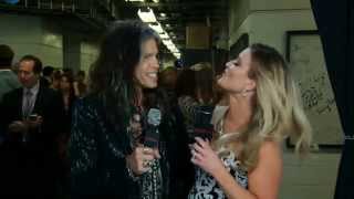 Kelly Sutton interviews Steven Tyler @ 2014 CMA's wearing Johnathan Kayne