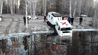 Amphibious BV206 Hagglund swimming in ice cold water