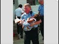 After 19 years, police officer and toddler he saved reunite