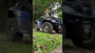 A Man On A Quad Bike With A Chainsaw 