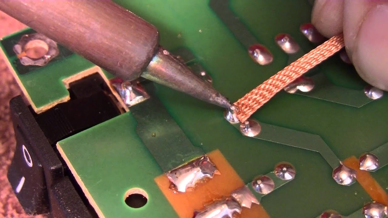 Solder removal from a circuit board - YouTube