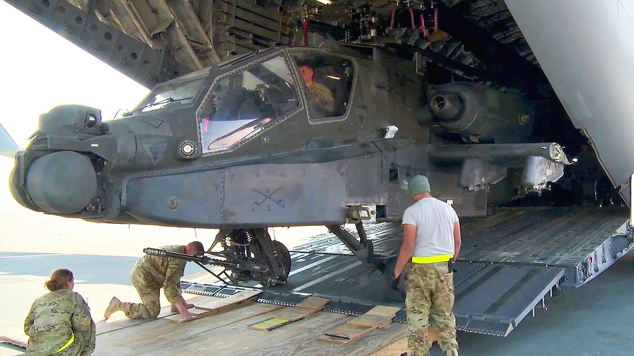 ⁣Unloading AH-64 Apache Helicopters from C-17 Globemaster III