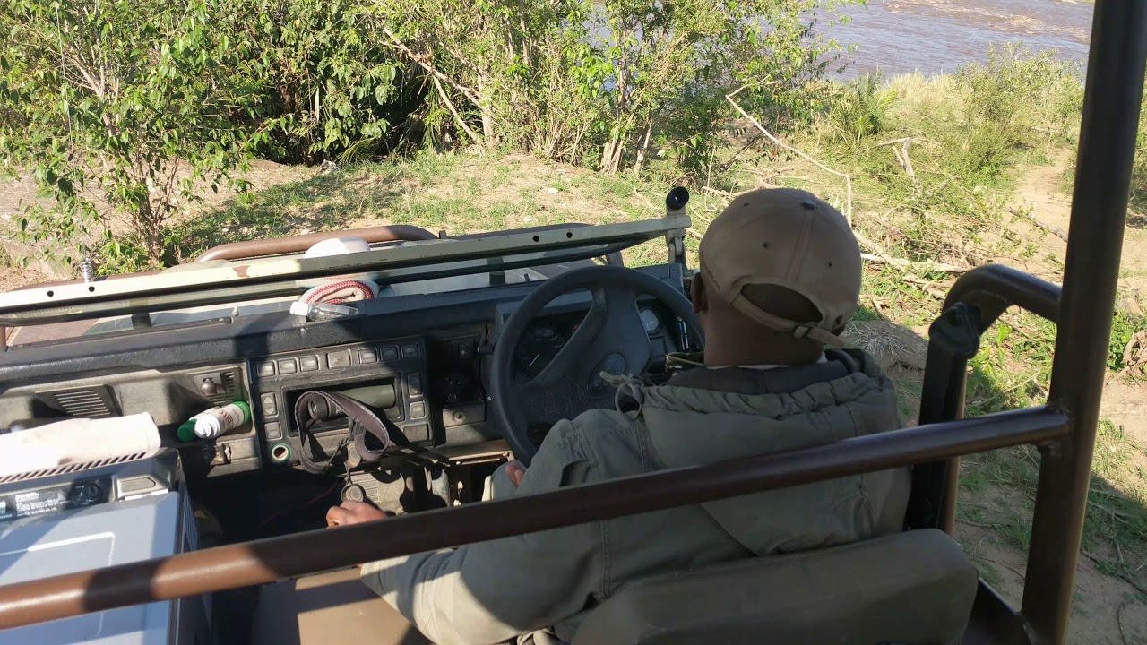 Range Rover fording faster Mara River, Singita Mara River, Tanzania ...