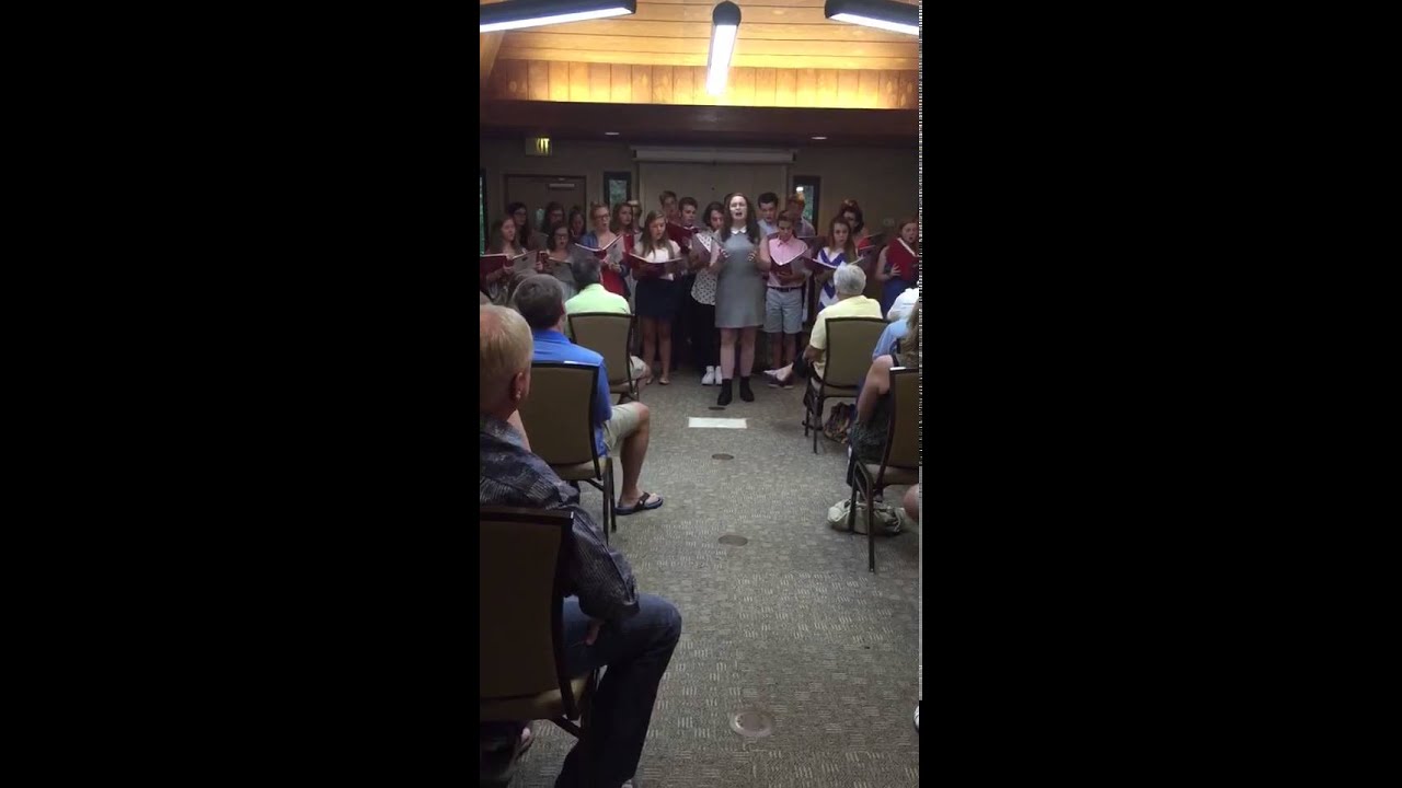 Amanda Disney and performing ensemble sing ONCE UPON A TIME