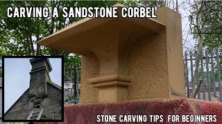Professional craftsman carves a huge sandstone corbel