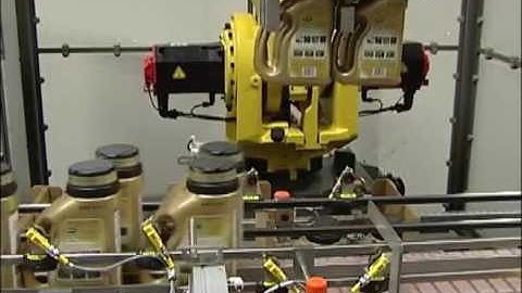 Pearson RTL Robotic Top Loader Loading Bottles into Trays | ProPac.com