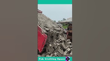 The Process Of Unloading Bricks From A Truck