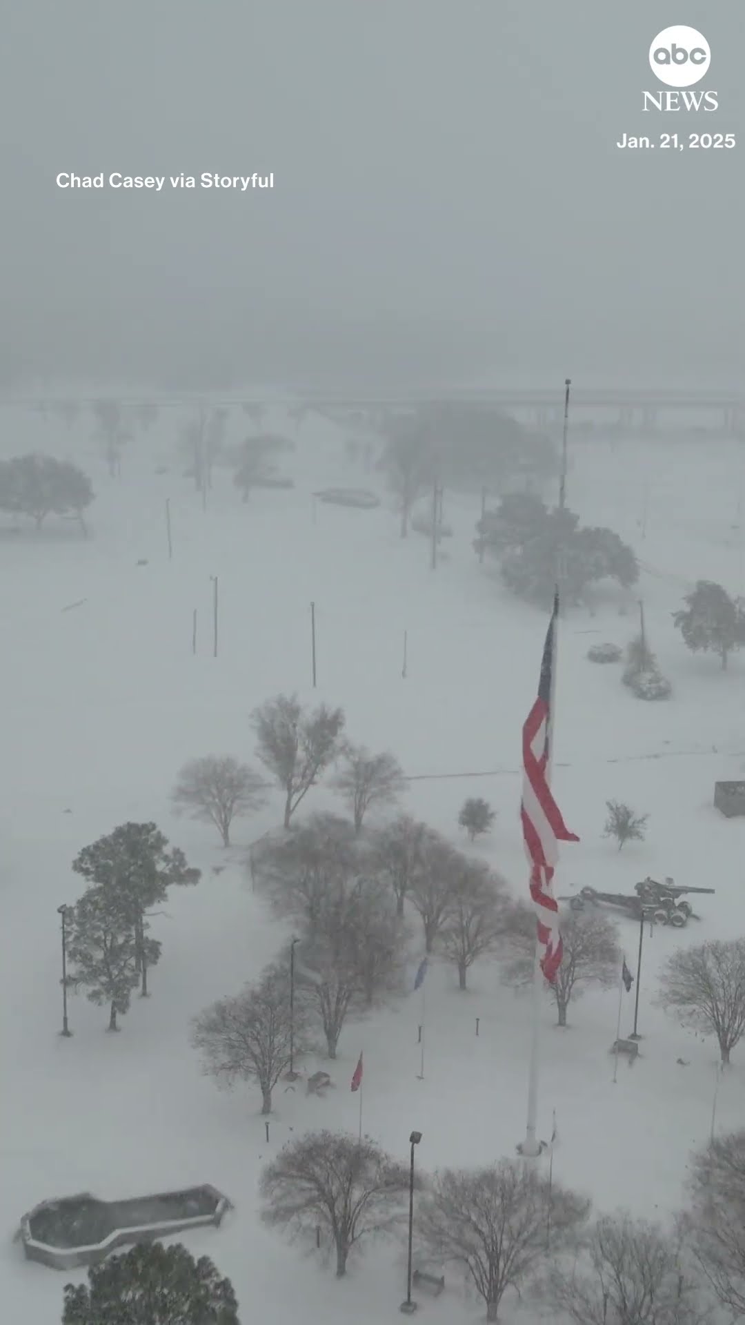 American flag billows in icy wind over Lake Charles