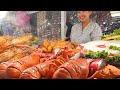 Street Food in Bangkok. Jumbo Lobster, Grilled Meat, Pad Thai at 'Central World' Square. Thailand