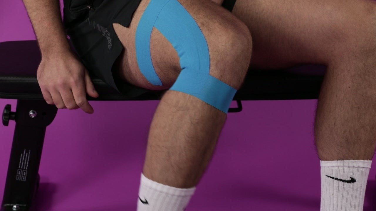 Applying Proworks kinesiology tape to the knee