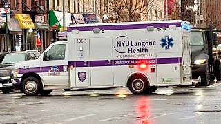 NYU LANGONE HEALTH HOSPITAL EMS AMBULANCE RESPONDING ON 2ND AVENUE IN HARLEM, MANHATTAN, NEW YORK.