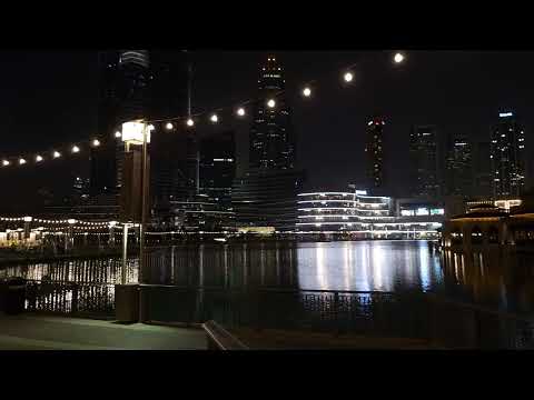 Dubai Mall outdoor area nighttime with music Burj Khalifa  Burj Park by Emaar  Three fingers statue