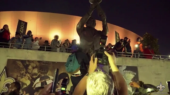 Saints fans hold impromptu second line to honor To...