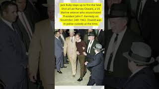 Jack Ruby steps up to fire the fatal shot at Lee Harvey Oswald, a US Marine veteran who assassinated