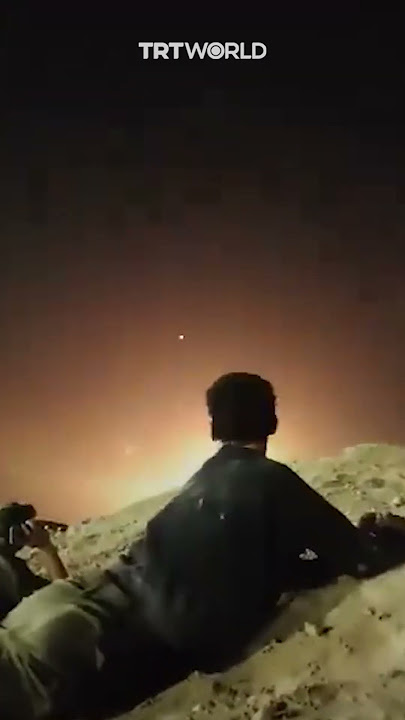 Israeli soldiers duck during Iran's missile barrage