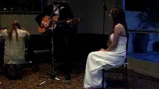 Rick Anderson sings to his new bride