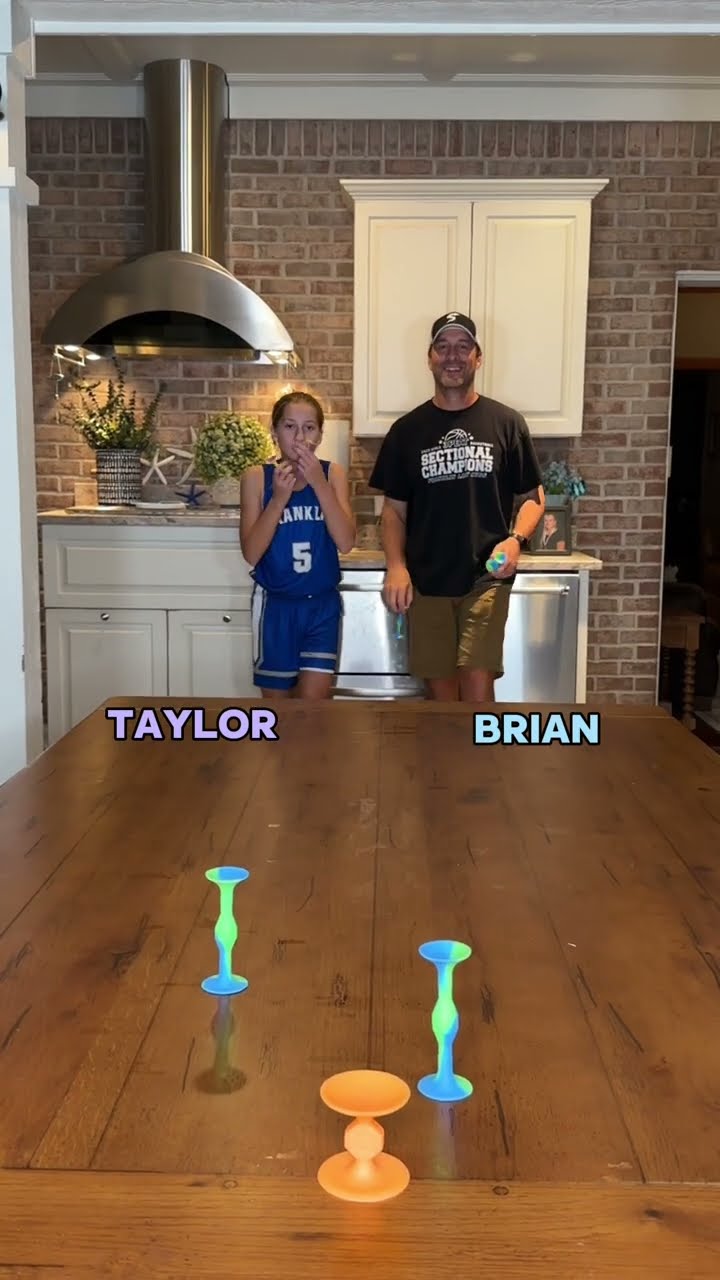 Can the daughter beat the dad in the pop darts challenge? #familygamenight #familyfun