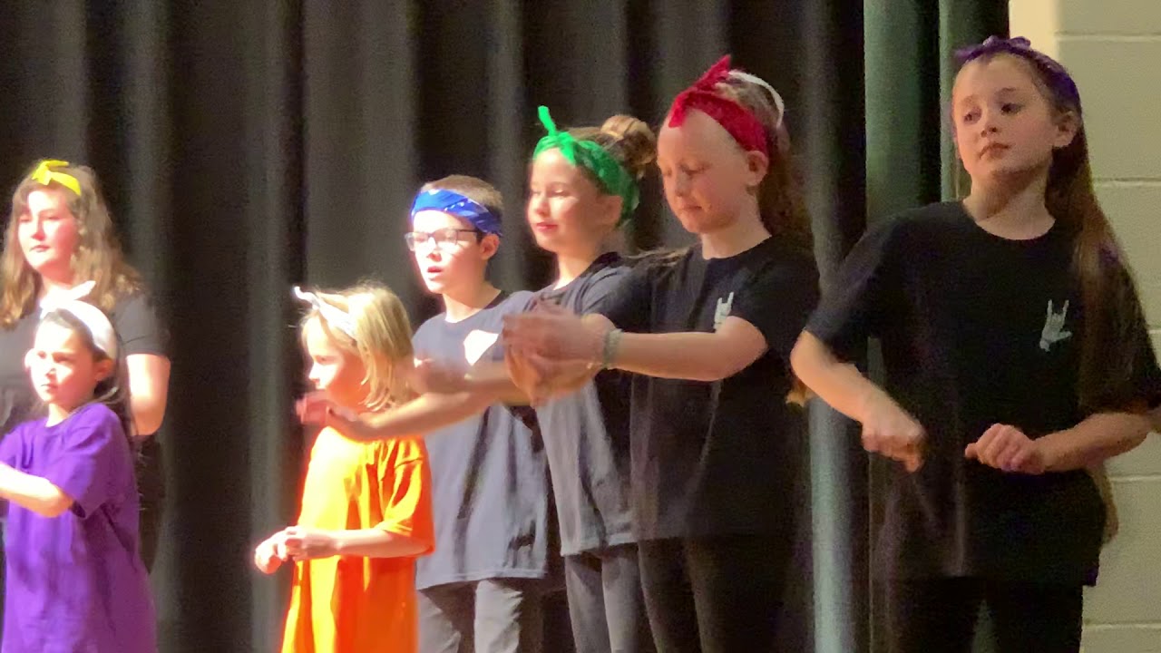 Ella and Clara perform We Are the World with their school ASL Club at