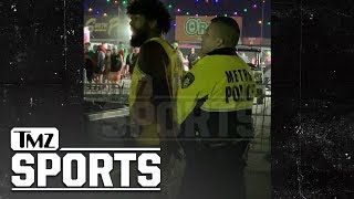 Ezekiel Elliott Handcuffed at EDC Vegas After Knocking Man to the Ground | TMZ Sports