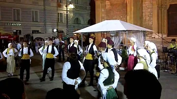 Traditional Bosnian dance by performers in open square in old town Sarajevo