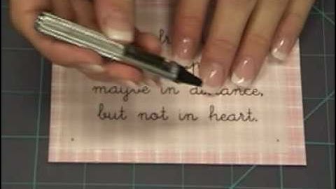 Learn how to use eyelets on scrapbook layouts