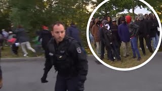 Migrants break through police line in Calais
