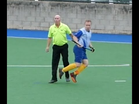 Hockey player trips over umpire