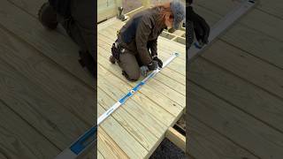 Deck building tip: Use a level as a fastener trough to make  screwing down decking easier