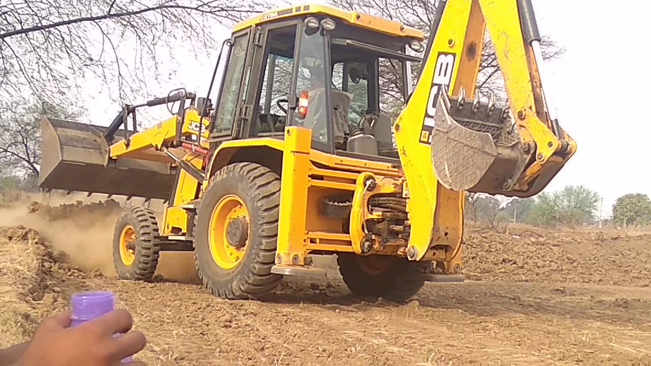 JCB Machine Cutting Mud and Loading To Dump Truck - JCB Backhoe Loader Working