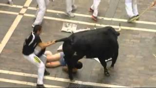 Excruciating moment a bull-runner gets gored at Pamplona
