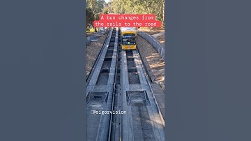A bus changes from the rails to the road on Adelaide Bus o